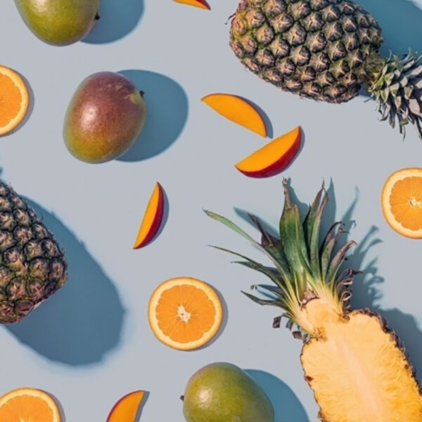 Cutting pieces of lemon and pineapple and mangos