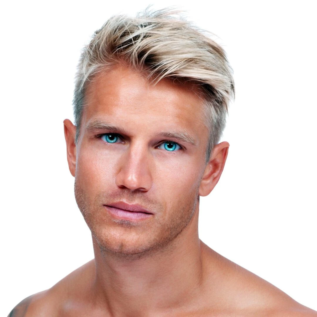 Portrait of a sexy shirtless man standing on a plain background with his hands on his hips